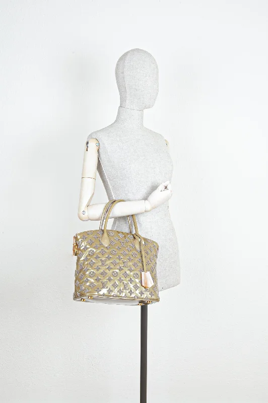 Louis Vuitton Twist bags with the iconic LV - turnlock closureLOUIS VUITTON Monogram Fascination Lockit Bag