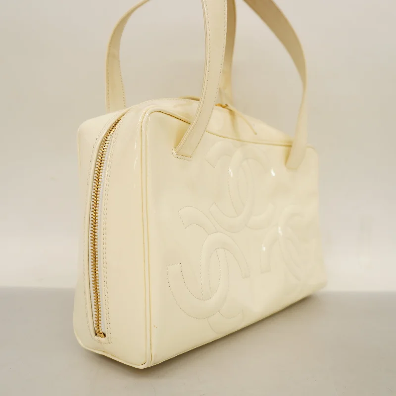 Chanel bags with intricate metal hardwareCHANEL  Triple Coco Women's Patent Leather Handbag Ivory