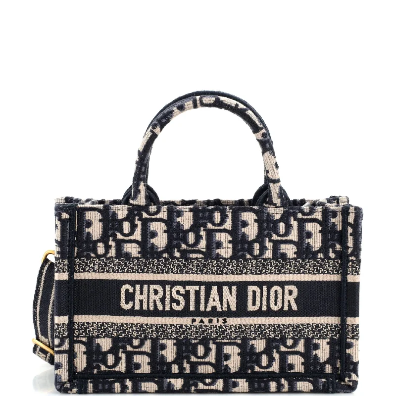 Christian Dior handbags with a snap - button closure and a decorative buckleBook Tote with Strap Oblique Canvas Mini