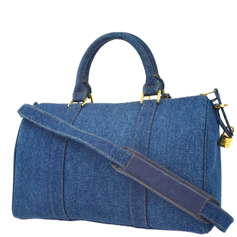 Chanel bags available at online luxury retaileChanel * Indigo Denim 2way Shoulder Duffle Travel Handbag