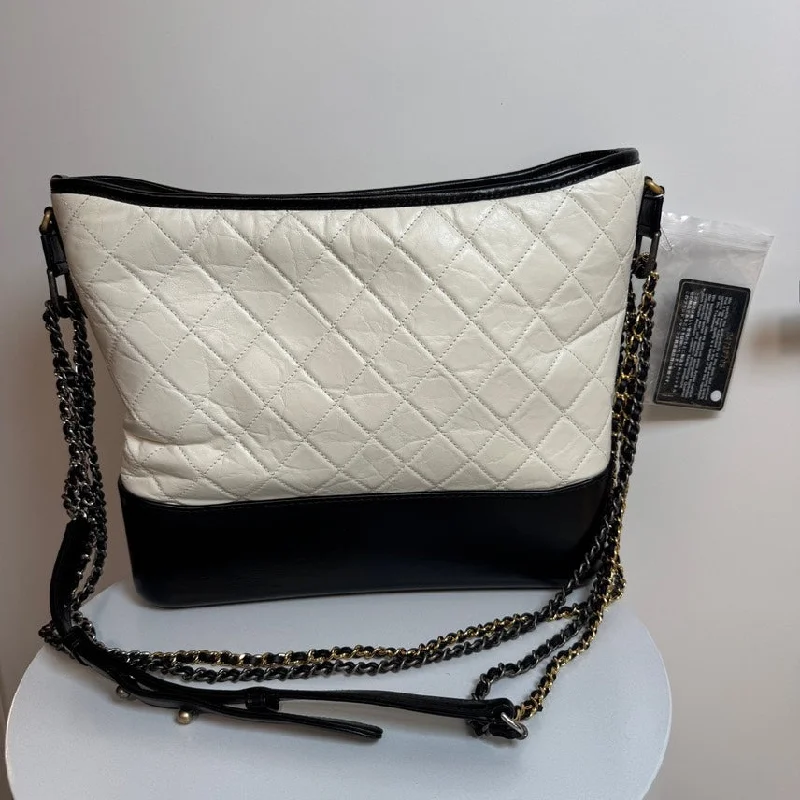 Chanel bags with intricate metal hardwareChanel Gabrielle GM White Black Leather Quilted Shoulder Bag