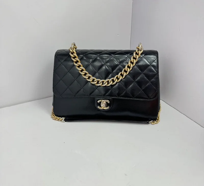 Chanel bags for women who love timeless fashionChanel Black Quilted Leather Hand-Held Crossbody Bag Medium